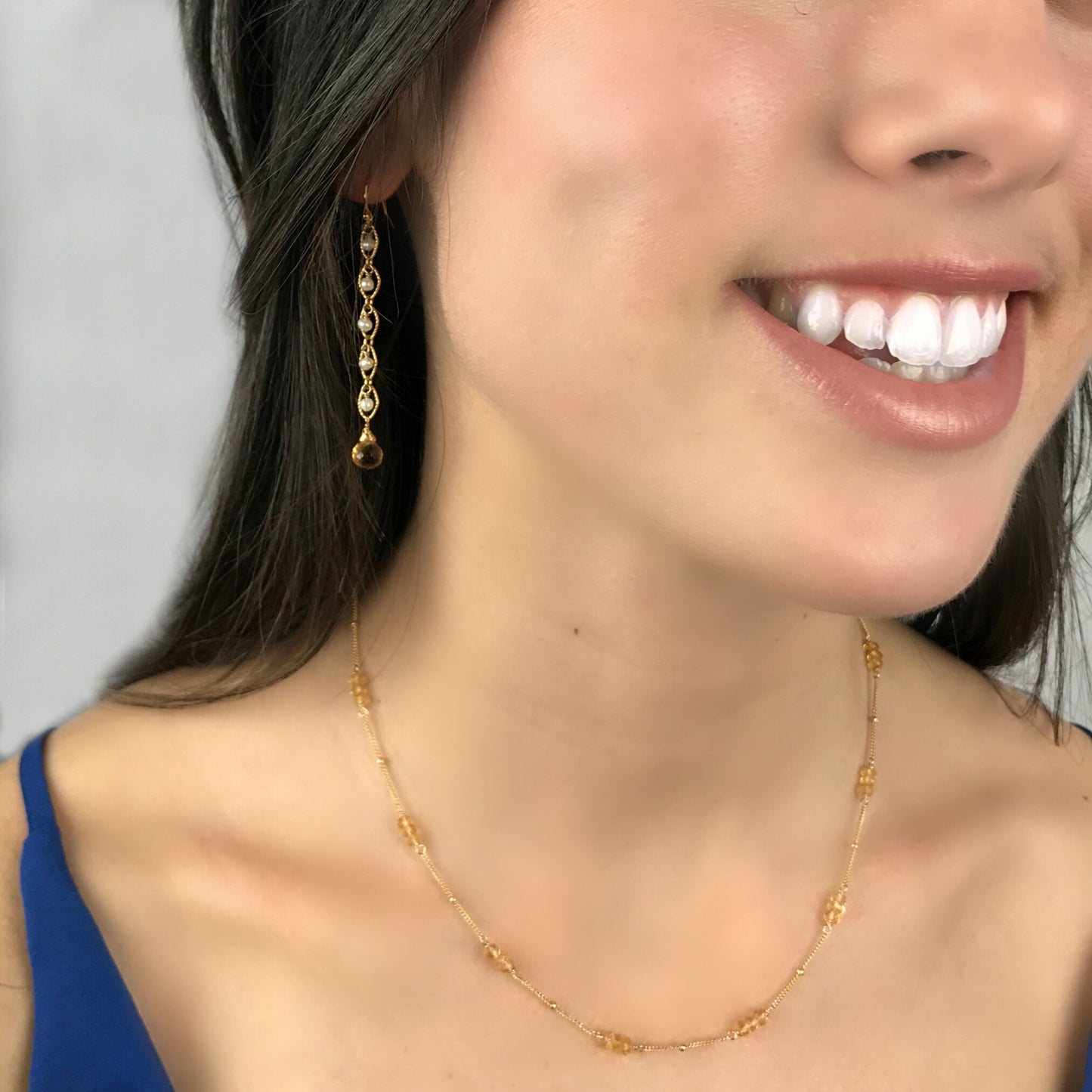 The necklace is crafted from Citrine rondelles, which are carefully hand-wrapped in your choice of 14K gold-filled or sterling silver wire. The Citrine stones are spaced along a satellite chain