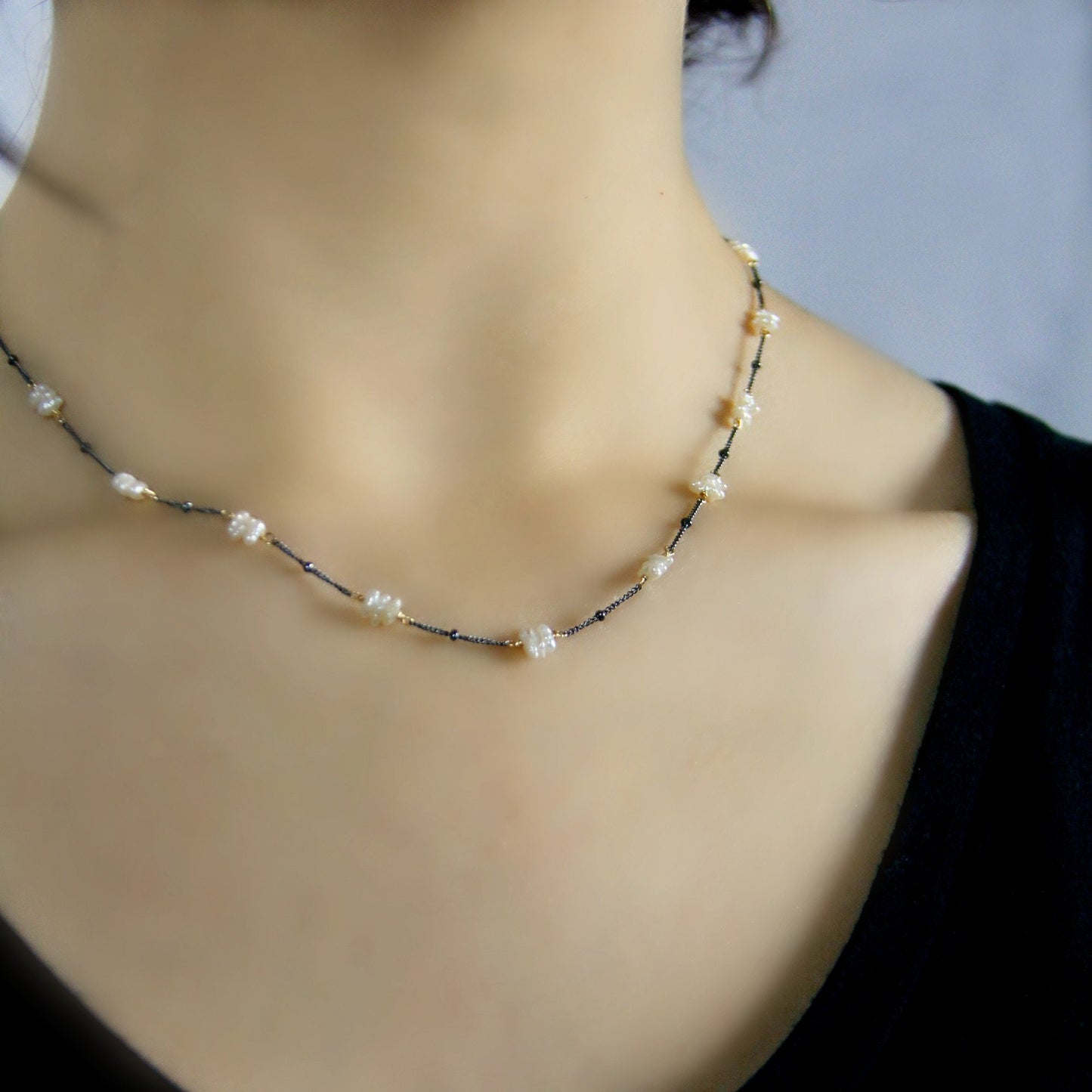 Side View Of the Fresh Water Pearl Necklace on Oxidized Sterling Silver Chain , hand wrapped with 14K Gold Filled Wire.