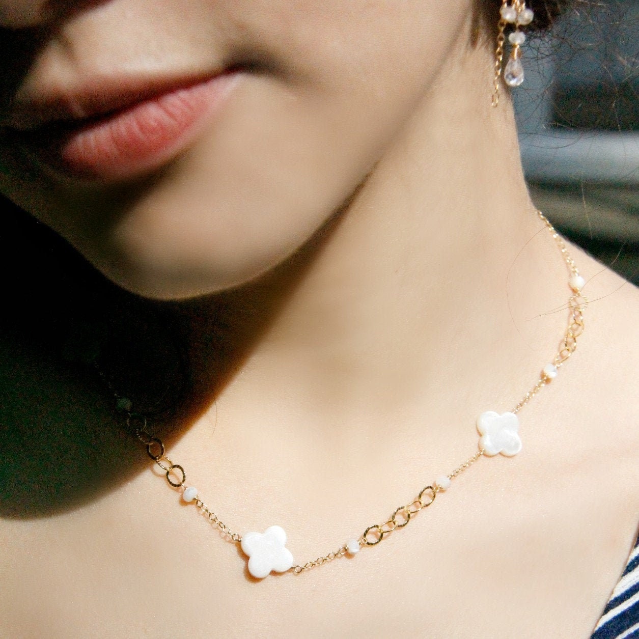 Close-up of Mother of Pearl Clover beads on choker necklace