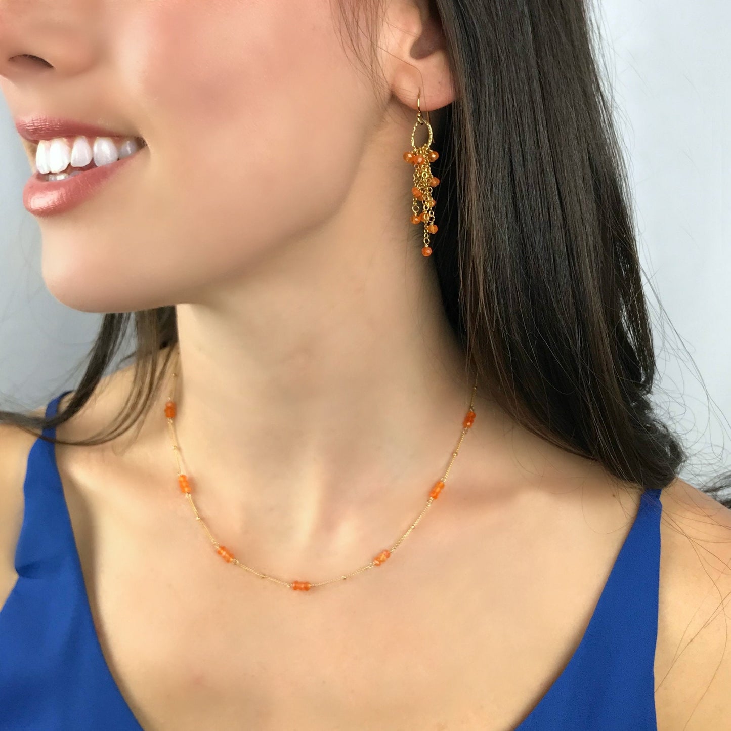 This beautiful Carnelian rondelle choker necklace is handcrafted with care and attention to detail. Each vibrant orange Carnelian gemstone is hand-wrapped in your choice of 14K Gold Filled or Sterling Silver wire. Unlike many minimalist necklaces, we’ve uniquely interspersed shimmering Carnelian rondelles along a delicate Satellite Chain, creating a stunning, eye-catching effect. This necklace is perfect for adding a touch of warmth and elegance to your everyday look while keeping things understated.