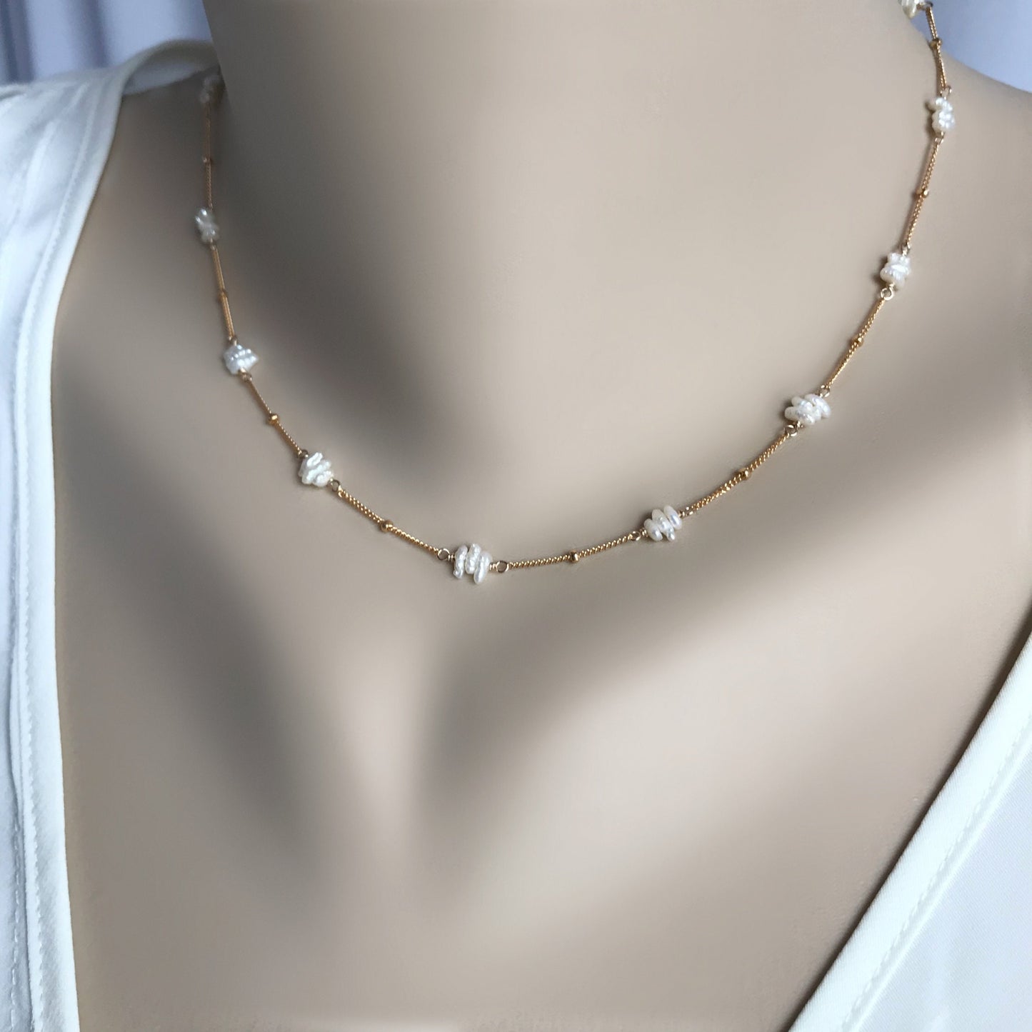This Freshwater Pearl Choker is a delicate and elegant piece, featuring beautiful fresh water pearl sticks hand-wrapped in your choice of 14K Gold Filled or Sterling Silver wire.