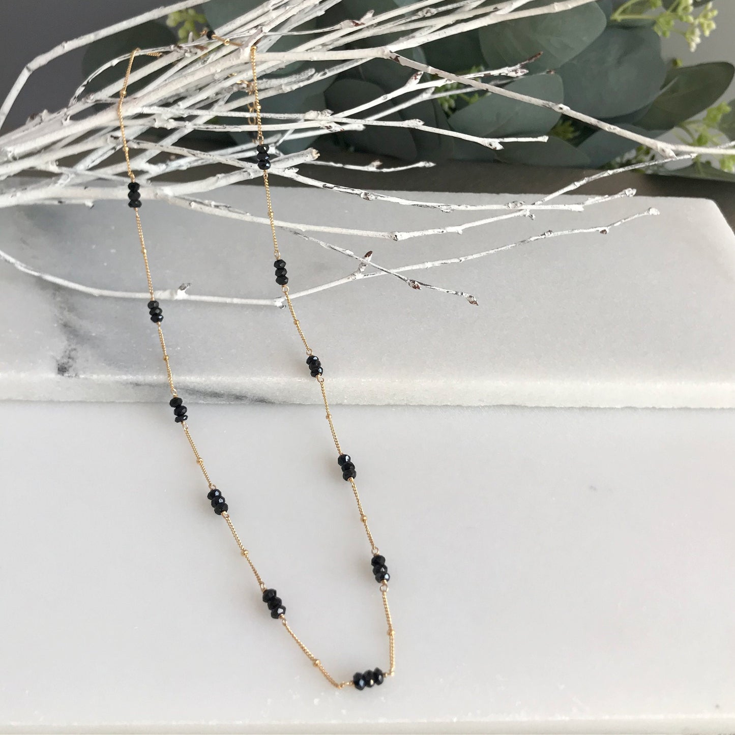 Necklace Features:
Crafted with Black Spinel Rondelles
Available in 14K Gold Filled, Sterling Silver, or Black Oxidized Sterling Silver
2” extension chain for adjustable wear
Handcrafted with care for a unique design
Perfect for layering or as a statement piece
Presented in an elegant jewelry box, ideal for gifting