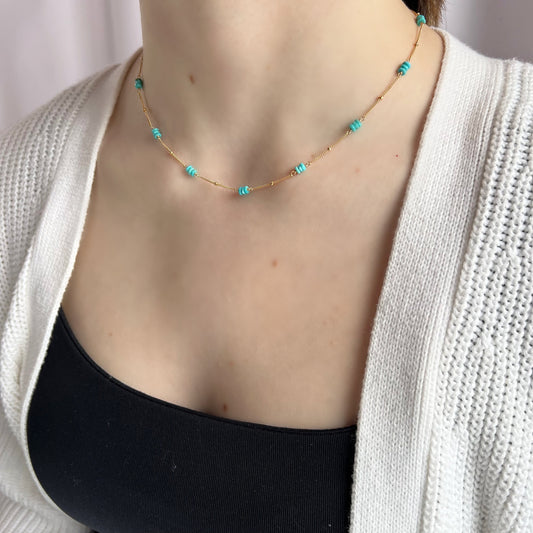Handcrafted Turquoise Necklace – 14K Gold Filled or Sterling Silver Cable Chain

This beautiful handcrafted necklace features faceted roundel turquoise stones, expertly hand-wrapped in your choice of 14K Gold-Filled or Sterling Silver wire. Unlike minimalist designs, this piece incorporates vibrant turquoise stones interspersed along a delicate cable chain, creating a stunning, eye-catching effect. The addition of a 2" extension chain allows for the perfect fit, whether worn alone or paired with other jewel